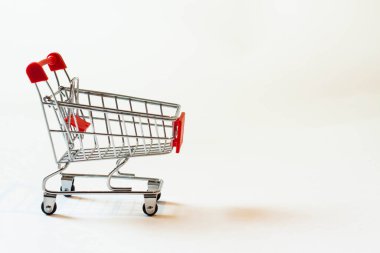 Red cart for collecting purchases at sales.