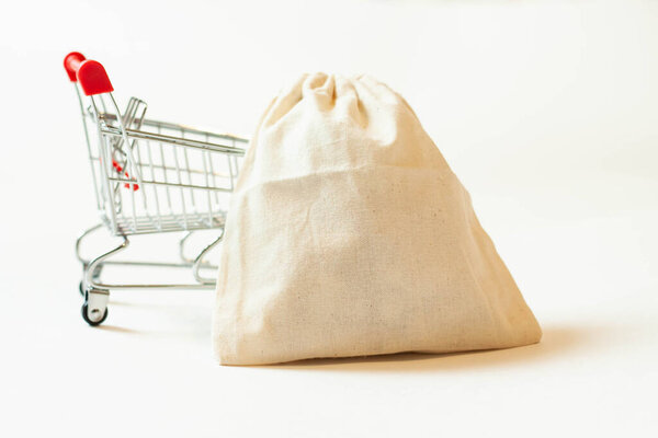 Cash knitted bag applications on a metal trolley for stock purchases.