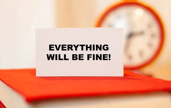 EVERYTHING WILL BE FINE. Concept of encouraging words on orange background