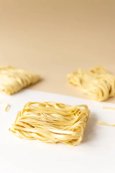 Natural Dry Homemade Noodles Brown Background Vertical Orientation Copy Space — Stock Photo, Image