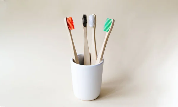 Four Multi Colored Bamboo Toothbrushes Ceramic Glass Eco Friendly Stuff — Stock Photo, Image