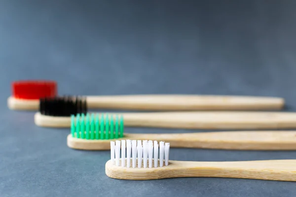 Four Multi Colored Bamboo Toothbrushes Lie Black Background Eco Friendly — Stock Photo, Image