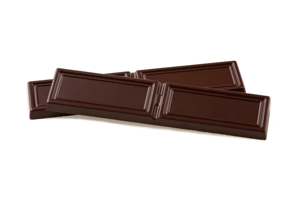 Два кусочка черного шоколада на белом фоне — стоковое фото