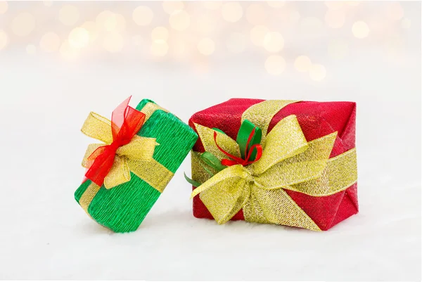 Red and green Christmas gift box with shiny golden ribbon Royalty Free Stock Images