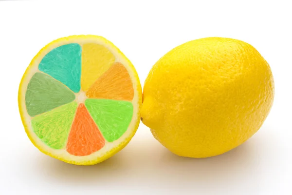 Sliced lemon in different colors and a lemon — Stock Photo, Image