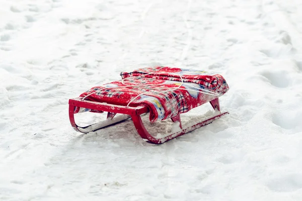 Child a sledge are on snow — Stock Photo, Image