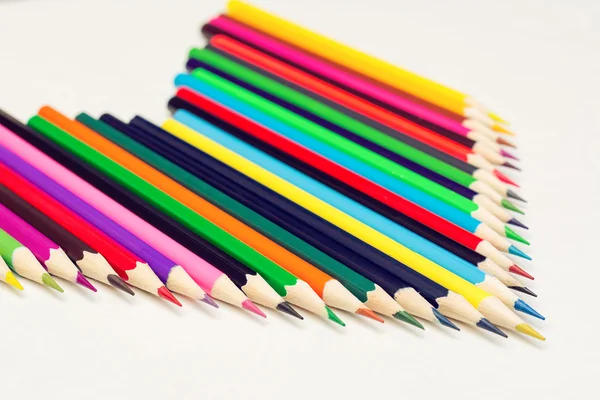Colored pencils lined up in rows — Stock Photo, Image