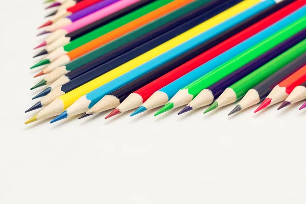 Colored pencils lined up in rows — Stock Photo, Image