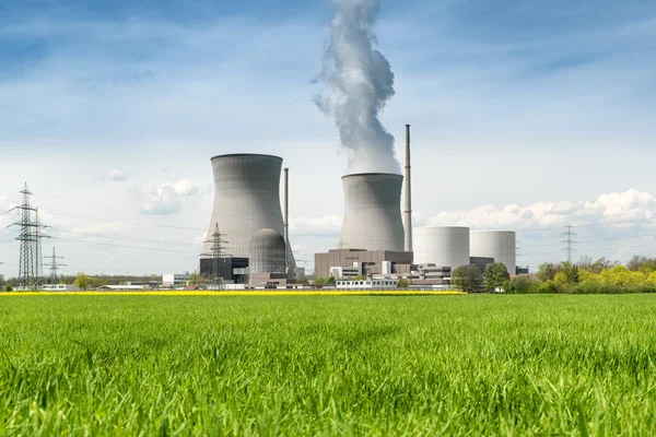 Nuclear power Energy concept - Nuclear power plant with green fi Stock Photo