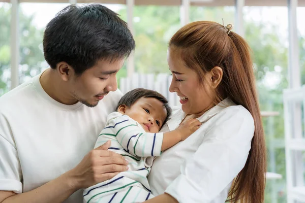 Asian Father Mother Hugging Months Baby Son Sofa Smiling Warm — Stock Photo, Image