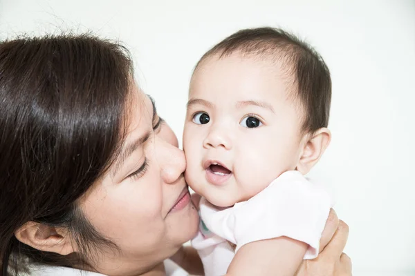 Happy cheerful family. Asian mother and baby kissing, laughing a — Stock Photo, Image