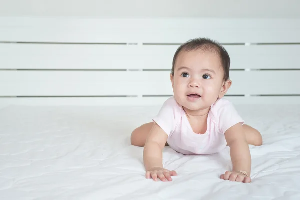 Cute crawling baby girl in bedroom — Stock Photo, Image