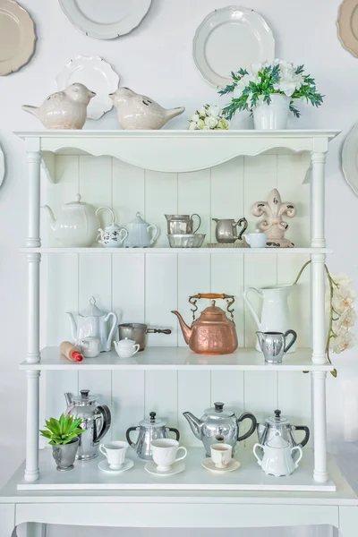 White shelf with vintage porcelain tableware — Stock Photo, Image