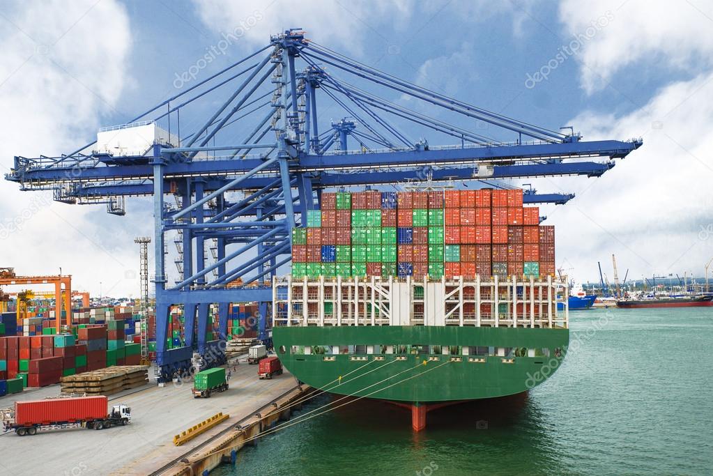 Container Ship in terminal working with shore crane at dock