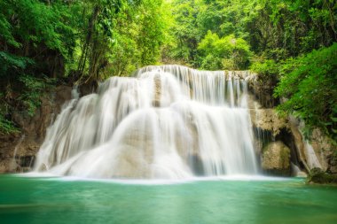 Deep forest Waterfall in Kanchanaburi,Thailand clipart