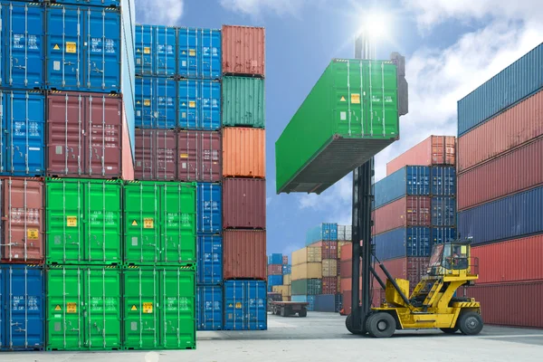 Forklift handling container box loading to truck in import expor — Stock Photo, Image