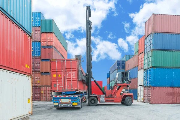 Crane lifter handling container box loading to truck — Stock Photo, Image