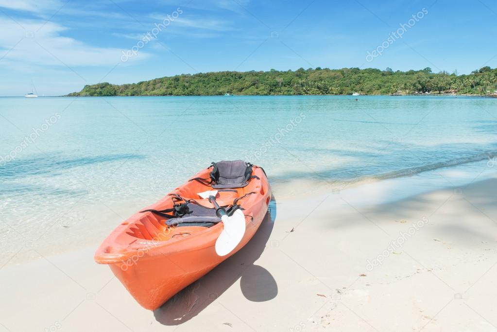 Summer, Travel, Vacation and Holiday concept - Orange kayaks on 