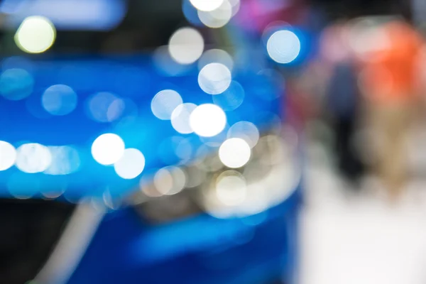 Abstract blurred photo of motor show, car show room — Stock Photo, Image
