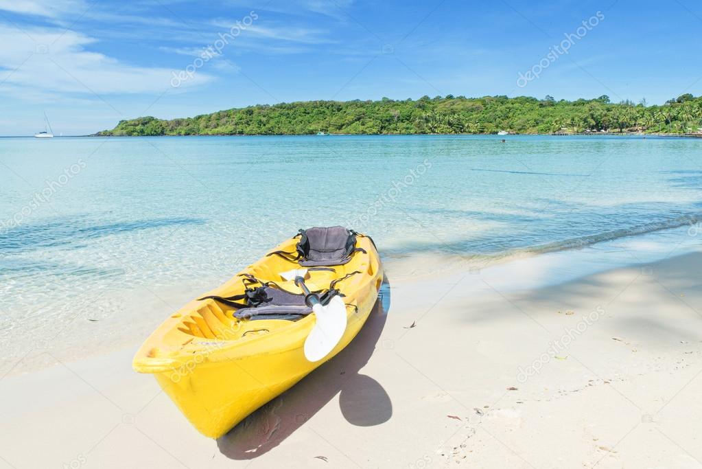 Summer, Travel, Vacation and Holiday concept - Yellow kayaks on 