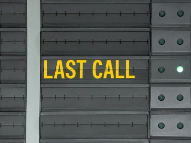 Last call message on airport information board.