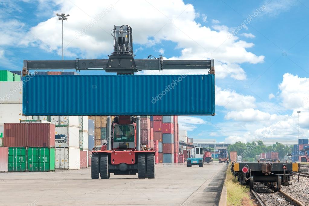 forklift handling container box loading to freight train