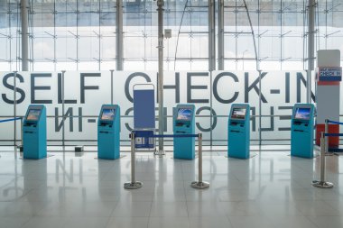 Self check-in kiosks in airport clipart