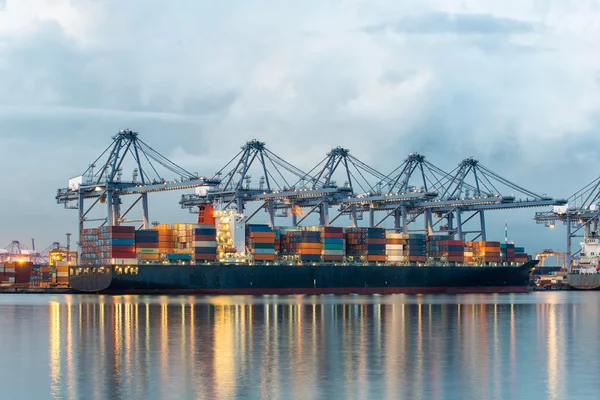 Container Cargo freight ship with working crane bridge in shipya — Stock Photo, Image