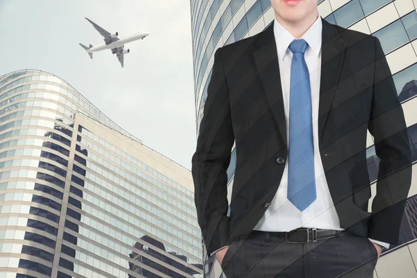 Double exposure of businessman and Airplane flying above glass o — Stock Photo, Image