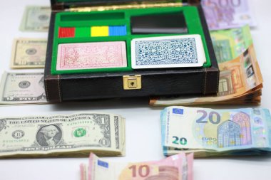 decks of cards, dice, chips and banknotes in metallic, gambling concept