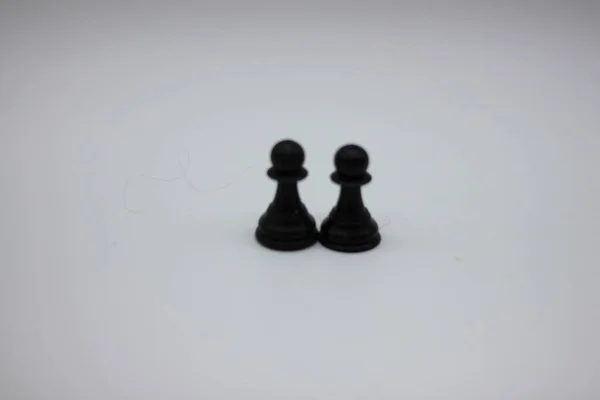 Svarta Schackpjäser Isolerade Vit Bakgrund — Stockfoto