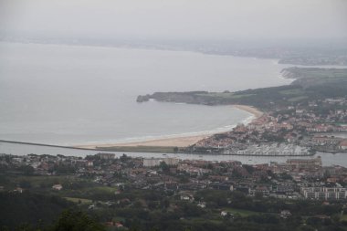 Hendaye beach in France seen from Mount Jaizkibel in the Basque Country on a cloudy summer day