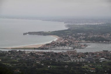 Hendaye beach in France seen from Mount Jaizkibel in the Basque Country on a cloudy summer day
