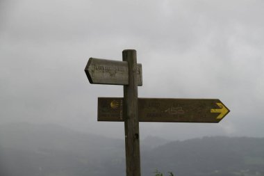 Wooden sign of Santiago's road on Mount Jaizkibel in the Basque Country