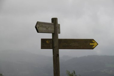 Wooden sign of Santiago's road on Mount Jaizkibel in the Basque Country