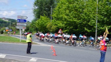 Erandio, Bizkaia, Pais Vasco, Spain: August, 1, 2021: 76th edition of the Getxo Circuit - Otxoa Brothers Memorial of cycling as it passes through the Asua crossing in Erandio Goikoa, on August 1, 2021 clipart
