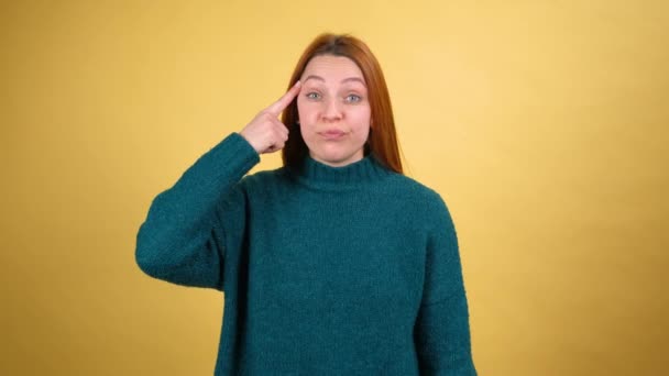 Displeased annoyed young woman showing stupid gesture, accusing crazy cuckoo mind, blaming insane idea, reckless plan, senseless dumb talk. — Αρχείο Βίντεο