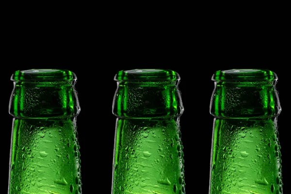 Row Beer bottle neck on black background — Stock Photo, Image