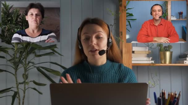 Una joven está hablando en una videollamada con un joven y una mujer. Una llamada amistosa. Debate de los compañeros de trabajo — Vídeos de Stock