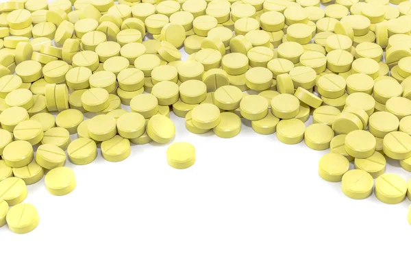 Pílulas verdes no chão branco — Fotografia de Stock