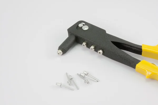 Black rivet pliers and rivet — Stock Photo, Image