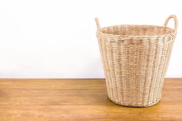 Rattan basket on wood floor — Stock Photo, Image