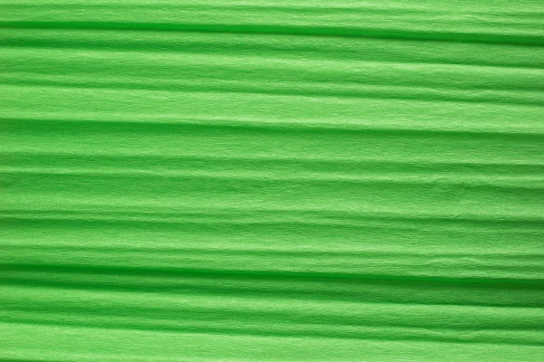 Green crepe paper background — Stock Photo, Image