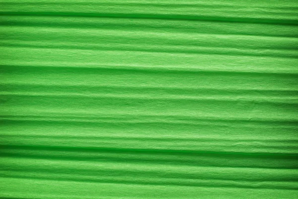 Green crepe paper background — Stock Photo, Image