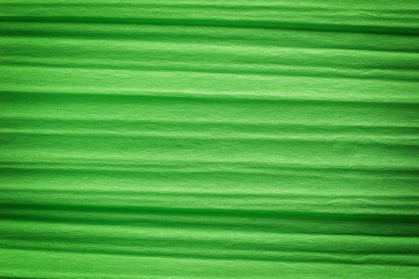 Green crepe paper background — Stock Photo, Image