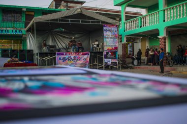 art festival stage with young man singing