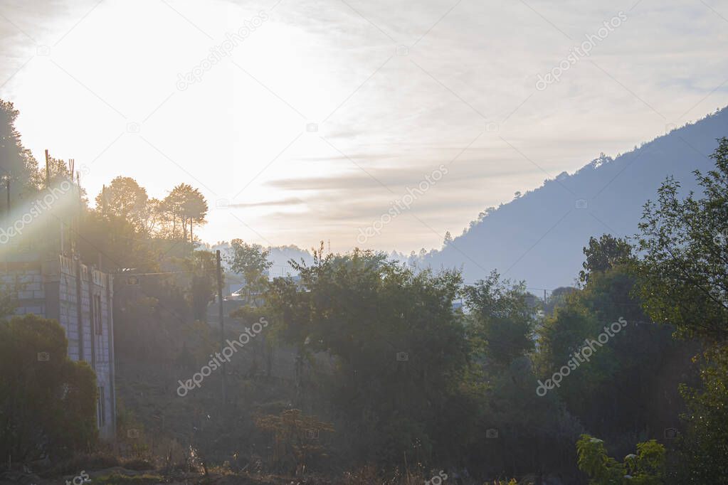 sun rising between the mountains with sunrise beautiful landscape