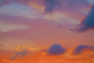 Beautiful sunset in the sea and red sky flared with clouds