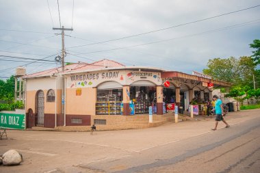 tent on roadside with clouds
