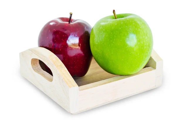 Červené a zelené jablko v dřevěném podnosu. — Stock fotografie